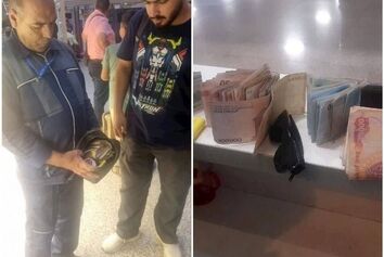 کارگر خدماتی فرودگاه مشهد کیف پول یک میلیاردی را به زائر خارجی بازگرداند